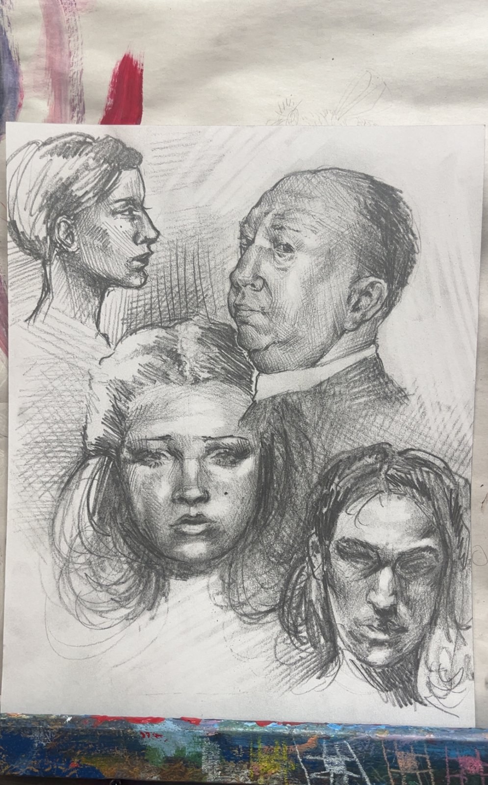 Sheet of four pencil portrait studies: a woman in profile, an older man and two young faces