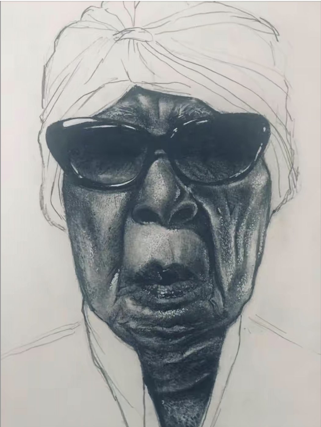 Charcoal portrait of an elderly woman in dark sunglasses and a head wrap, hand at her chin