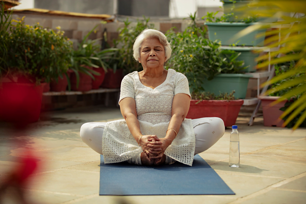A senior lady enjoying the benefits of yoga.