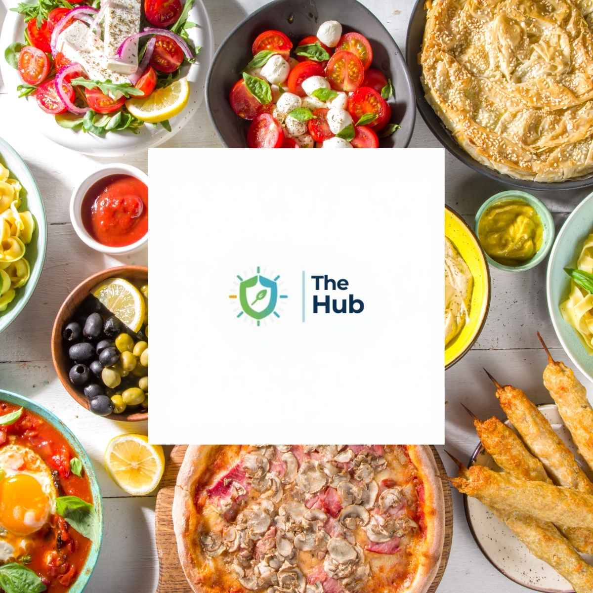Table full of food with "the hub" logo