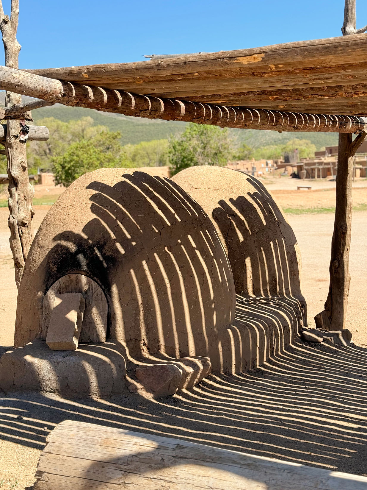 CLAY OVENS SMELLED OF SMOKE, GROUND CORN FLOUR AND BAKED-IN SUN