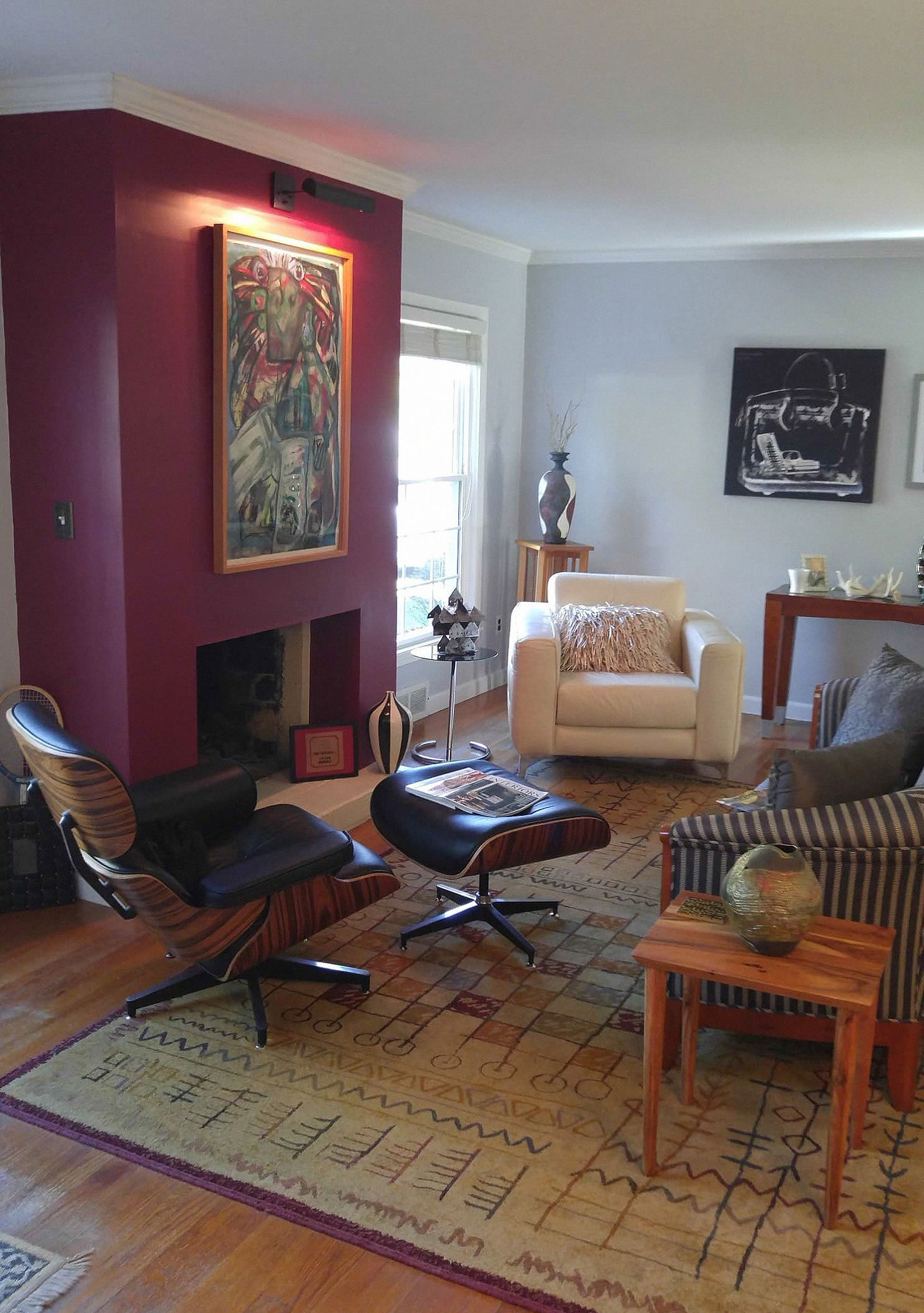 Living room before redesign with scattered furniture and lack of clear focal point around fireplace