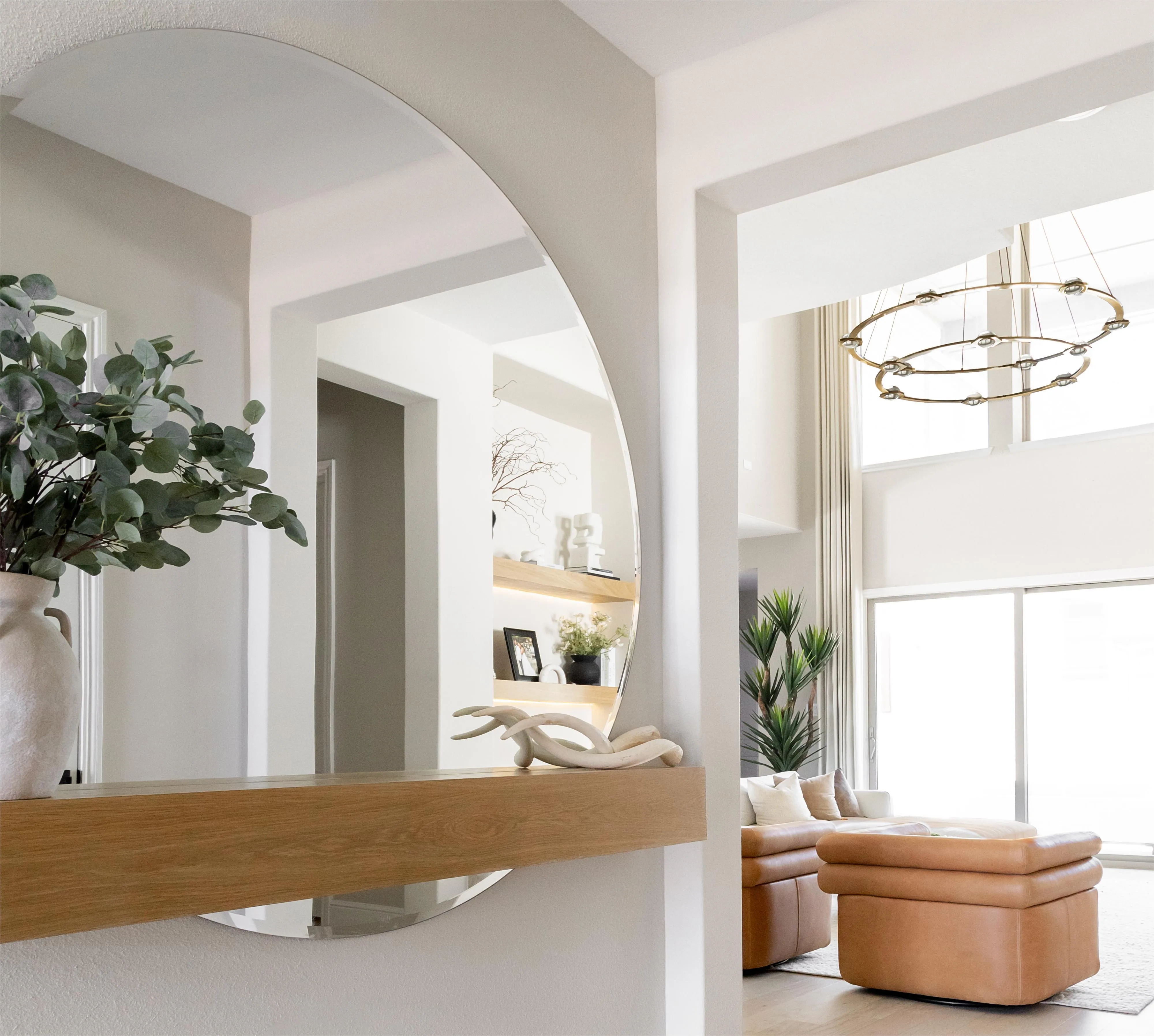 Bright living room with natural textures designed by Eliriah Interiors