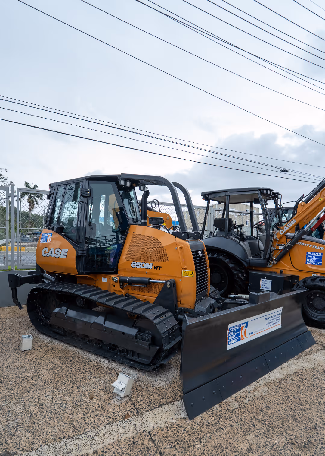 CASE 650M WT bulldozer with heavy-duty steel tracks and front blade on display at PR Wire Group equipment lot in Puerto Rico, built for land clearing, grading, and construction site preparation.