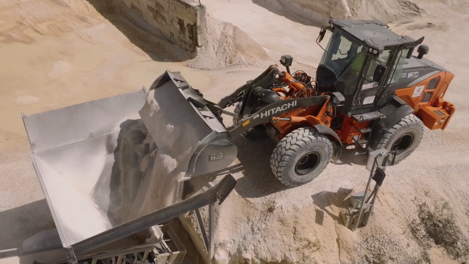 Hitachi wheel loader loading aggregate at a Macromix Concrete production plant in Puerto Rico.