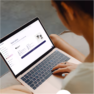 Person using a laptop displaying a marketing dashboard with graphs and options.