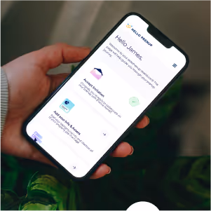 Hand holding a smartphone displaying a personalized app interface greeting the user James with options for account activity and security settings.