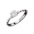 Silver ring with a central round diamond and smaller diamonds along the band.