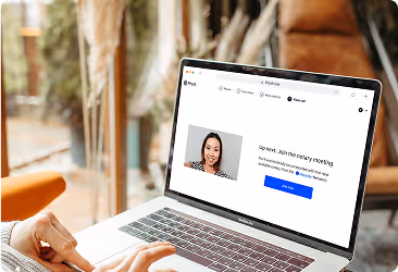 Person using a laptop displaying a video call interface with a participant named John and a join meeting button.