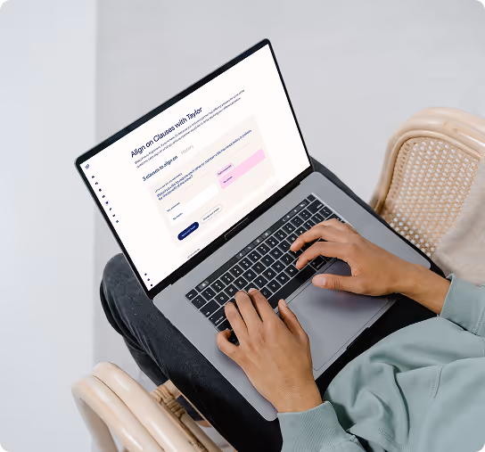 Person typing on a laptop showing a webpage titled 'Align on Clauses with Taylor' with a form submission interface.