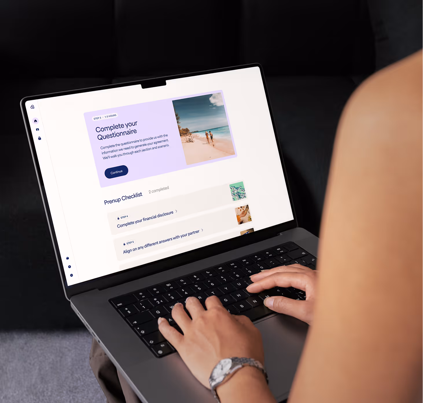 Person typing on a laptop displaying a questionnaire webpage with a prenup checklist.