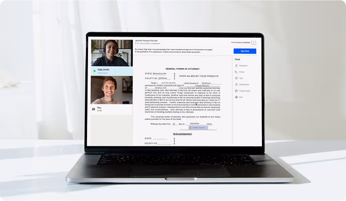 Laptop on a white desk displaying a video call with two participants and a digital General Power of Attorney document on screen.