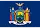 Flag of New York State featuring the state coat of arms with a shield, two supporters, an eagle, and a banner with the state motto.