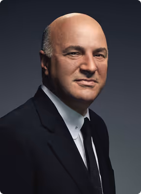 Portrait of a bald man in a black suit with a white shirt and black tie against a dark background.