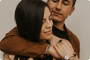 Couple embracing with eyes closed, showing affection and closeness.