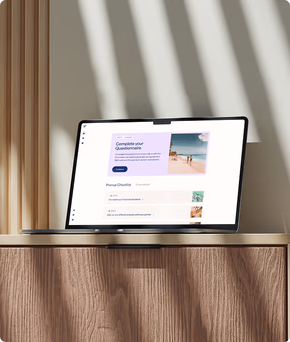 Laptop on wooden cabinet displaying a questionnaire completion webpage with checklist items and a beach photo.