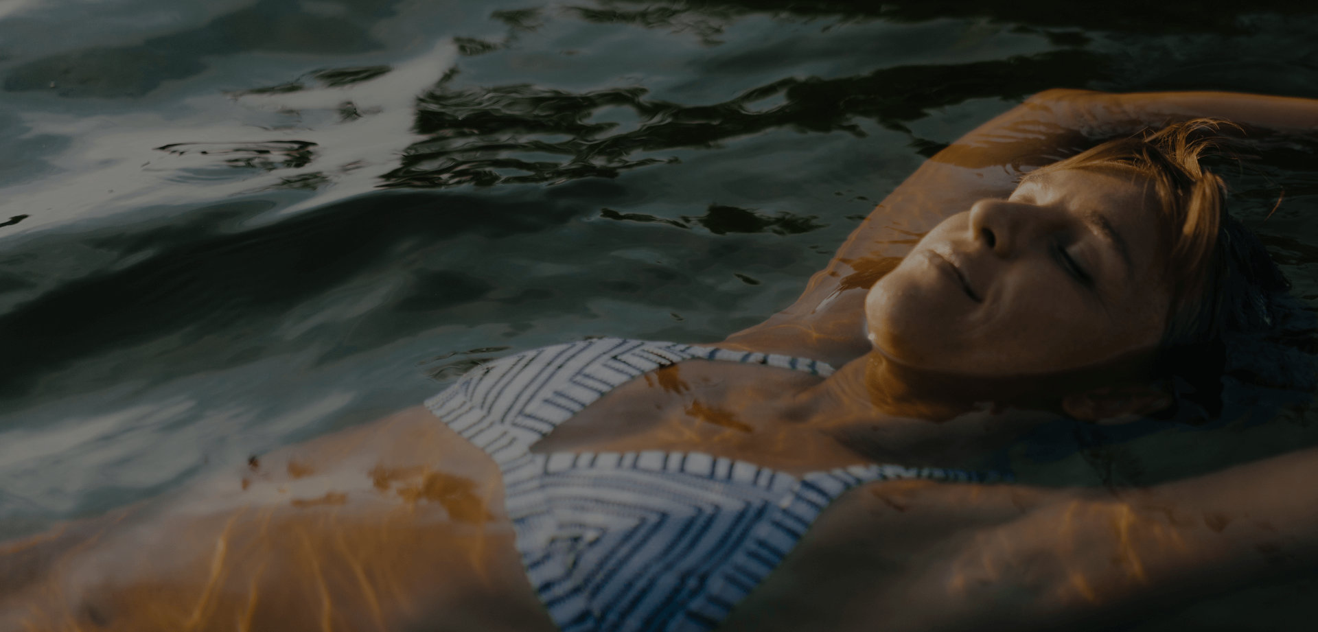 Woman relaxing in a pool