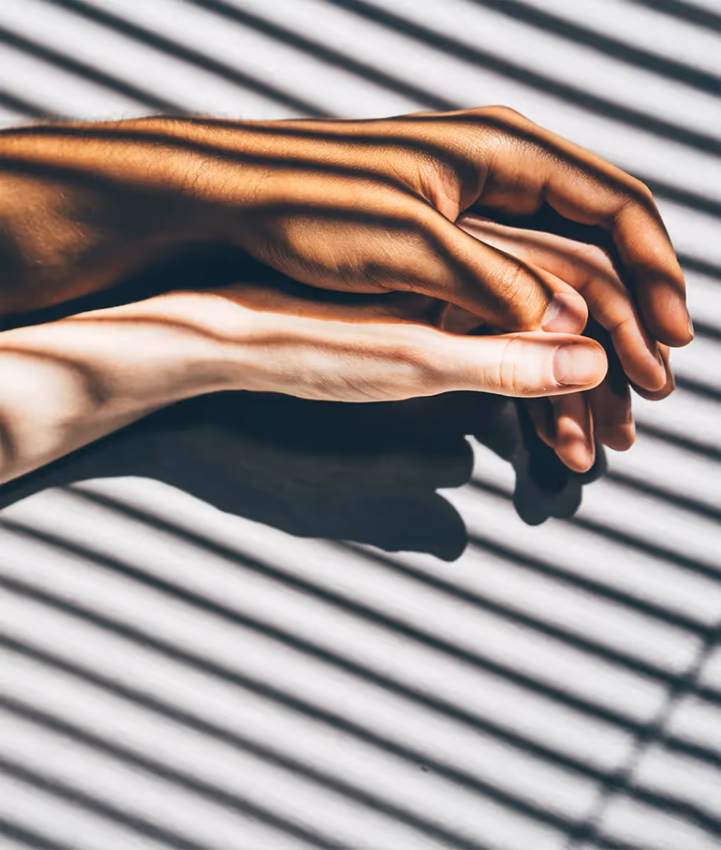 Two hands embracing