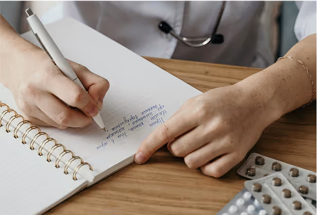 Doctor writing a prescription.