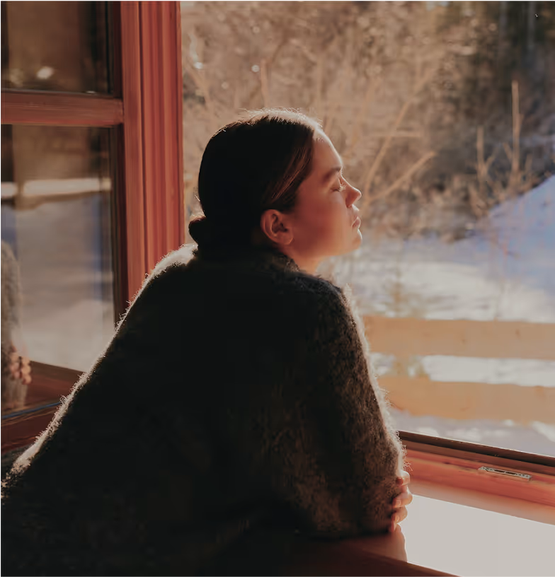 Woman gazing out the window