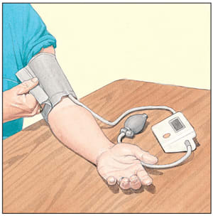 Person using a home blood pressure device.