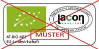 Logo mit grüner Bio-Sterne-Grafik und Text 'AT-BIO-402 EU-Landwirtschaft' sowie Qualitätszeichen von 'Lacon', überlagert von einem roten Kreuz und dem Schriftzug 'Muster'.
