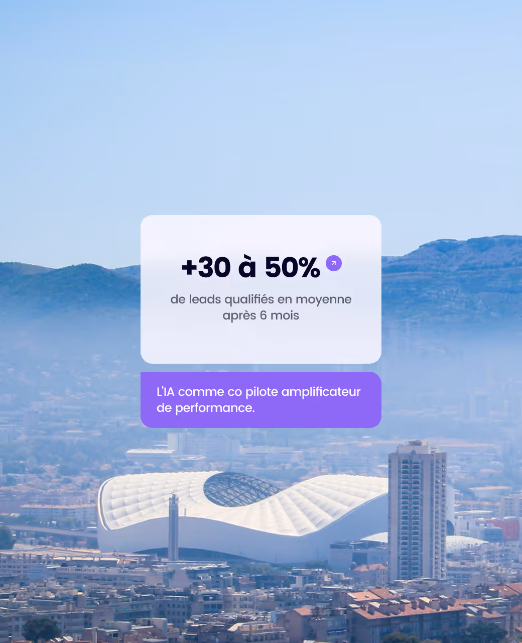 Cityscape with a modern white stadium and surrounding buildings under a clear blue sky.