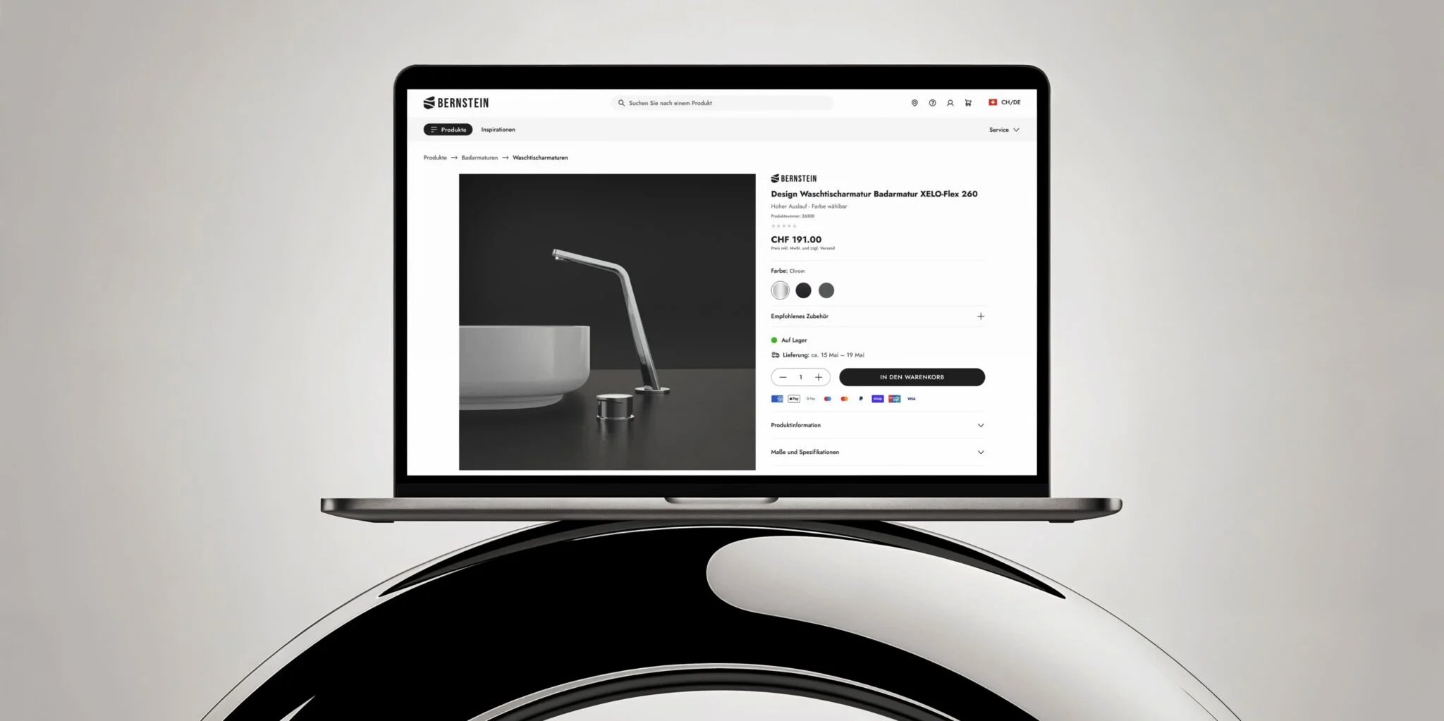Laptop displaying a product page for Bernstein Design faucet XELO-Flex 260 priced at CHF 191.00 on a minimalist background.
