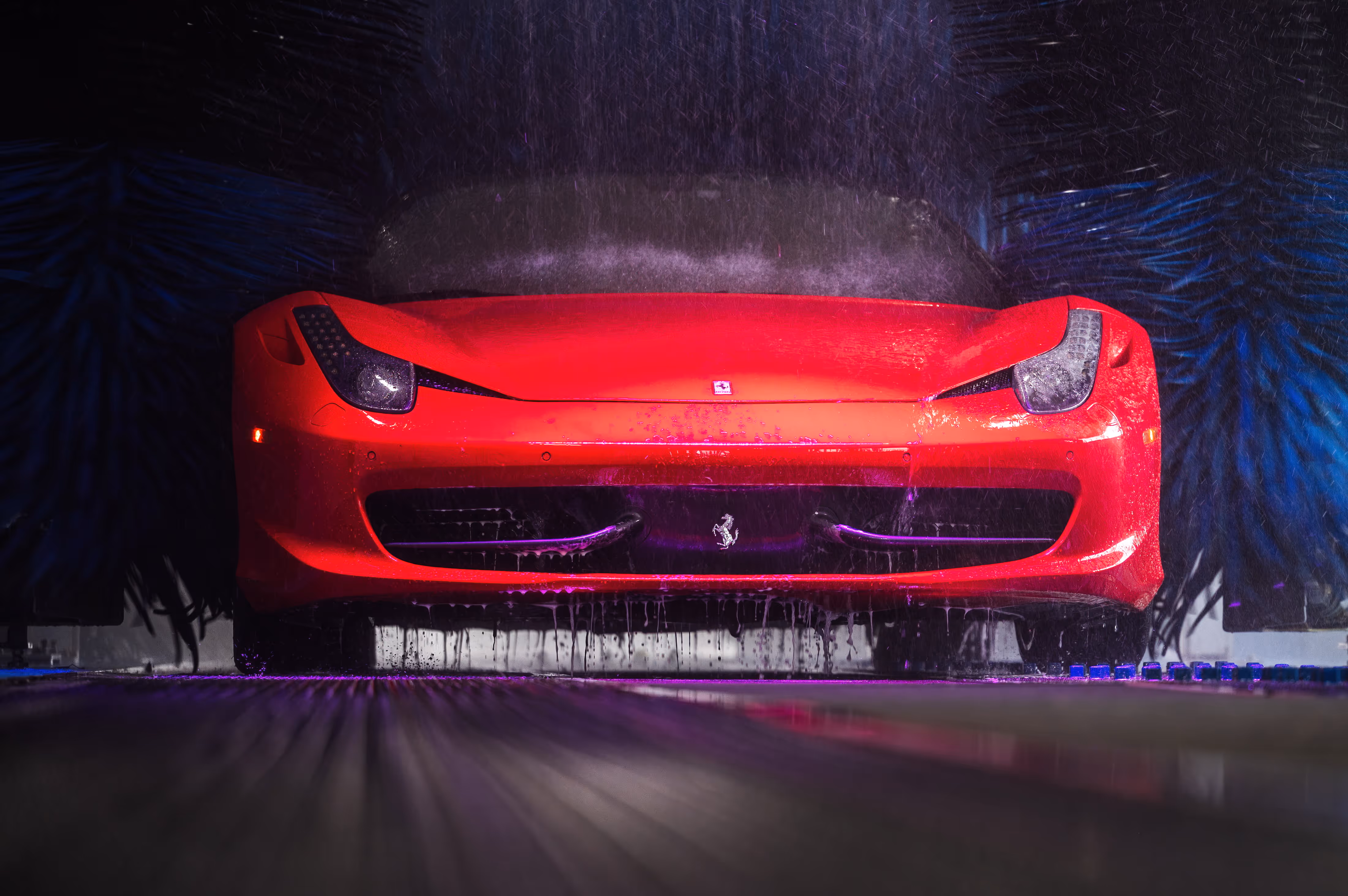 Red car in premium automated car wash in Hamilton