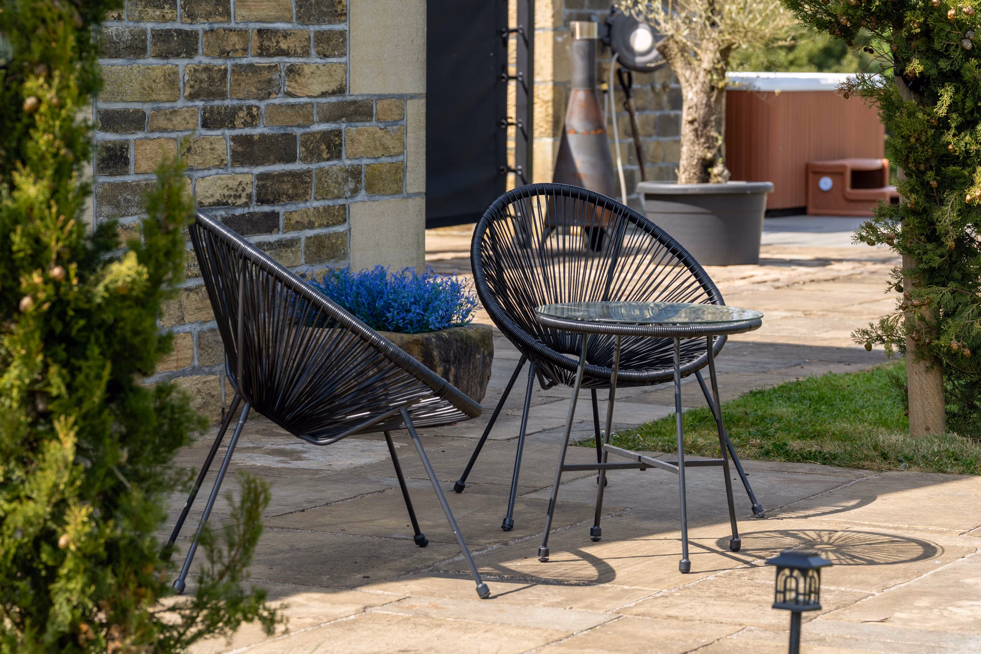 A outdoor dining set, located just outside the Barn Annex