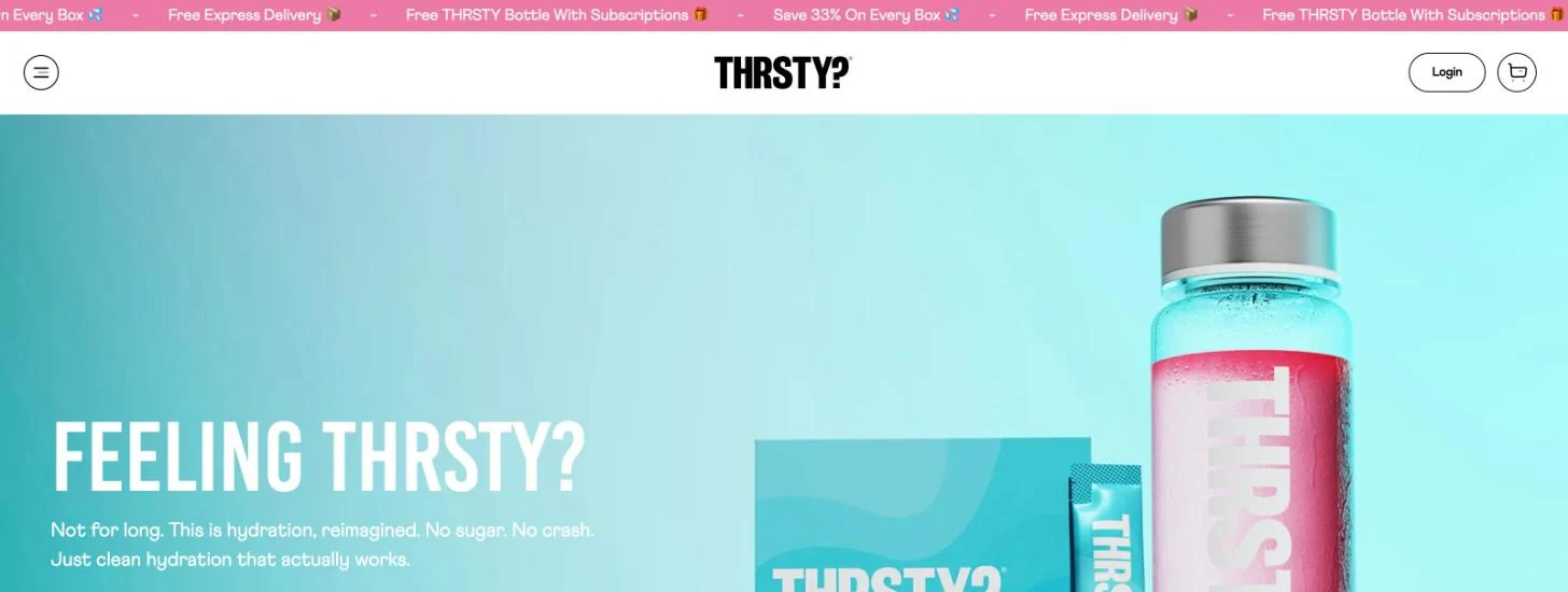 THRSTY home page with a pink scrolling announcement bar reading Save 33% On Every Box, Free Express Delivery and Free THRSTY Bottle With Subscriptions above the header and the Feeling THRSTY hero