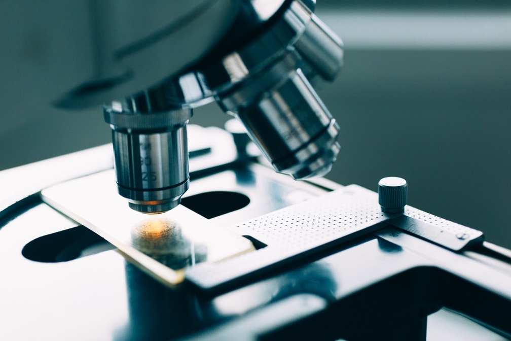 Psychometric testing concept - microscope representing deeper analysis of leadership capability.