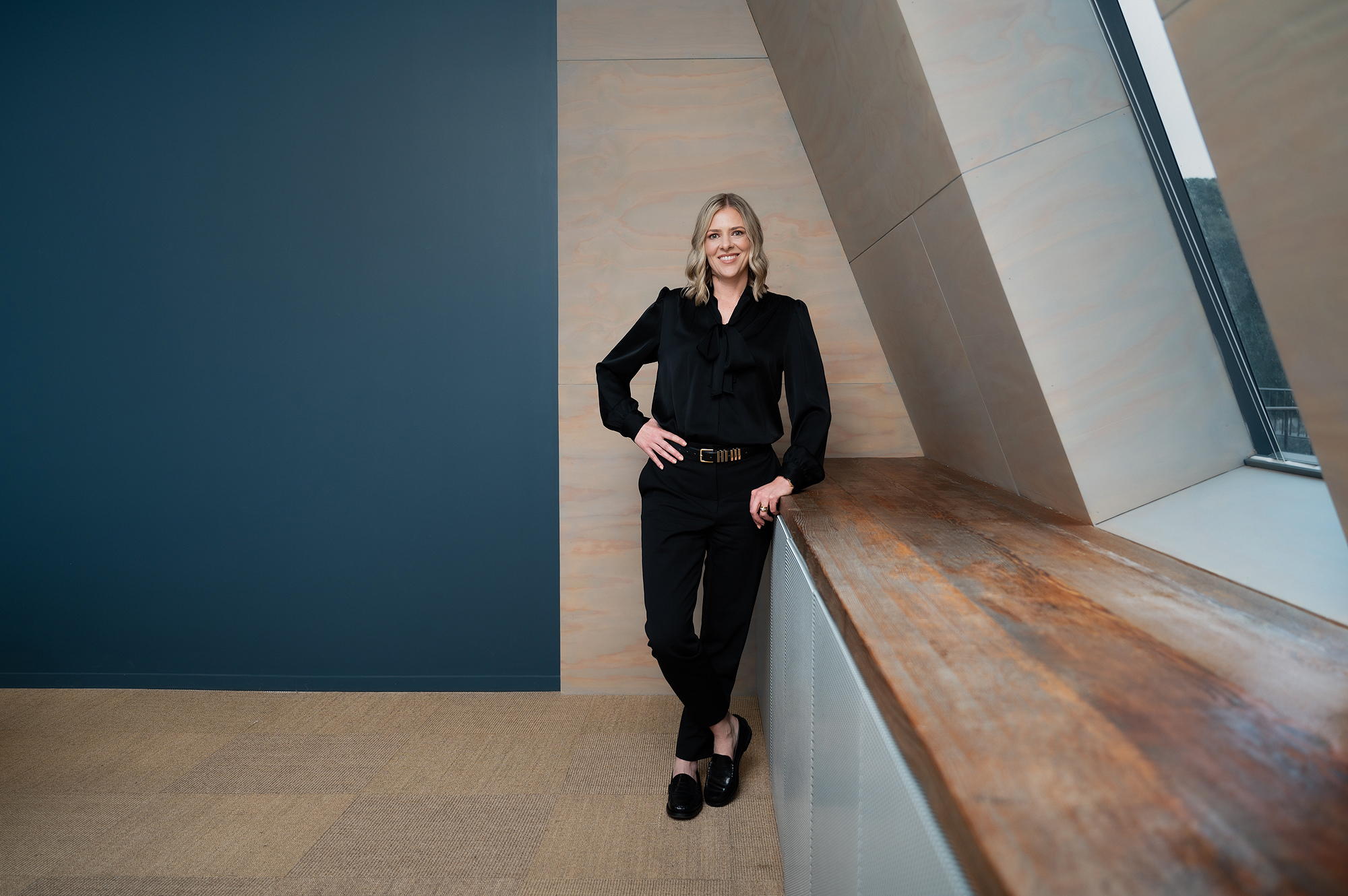 Business psychologist, Shanel Winning, standing in a boardroom.