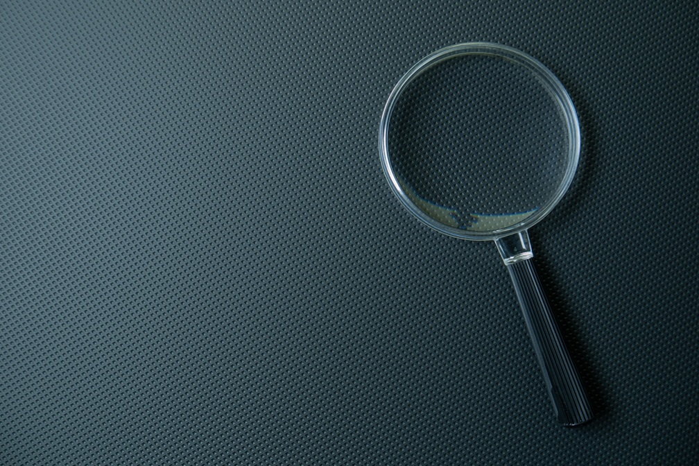 Core Insight: A magnifying glass, symbolising getting beneath interview gloss and seeing the detail.
