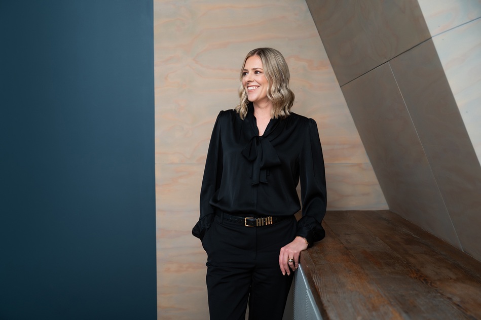 Shanel Winning, standing in the boardroom.