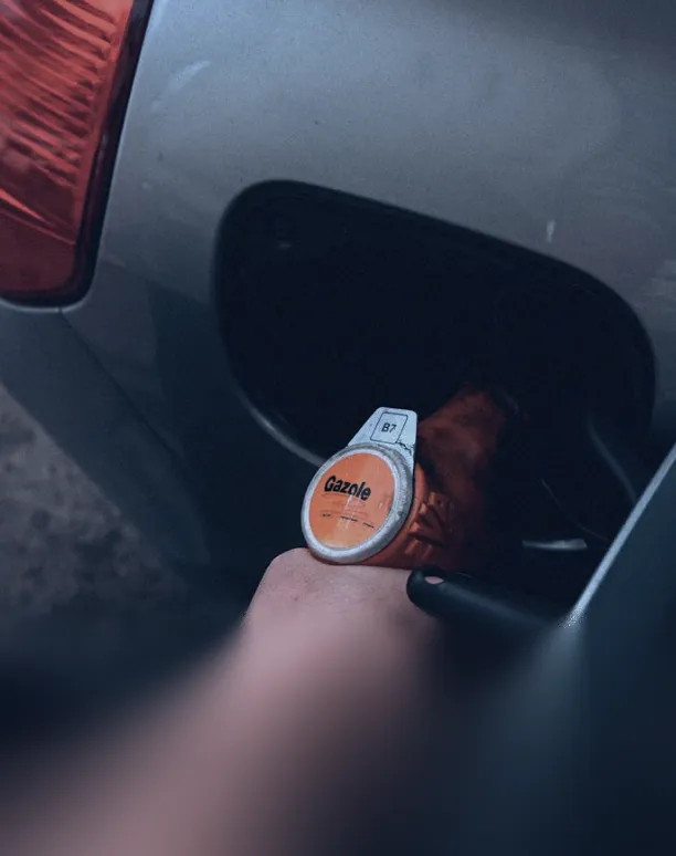 Close-up of Gazole diesel pump in car.