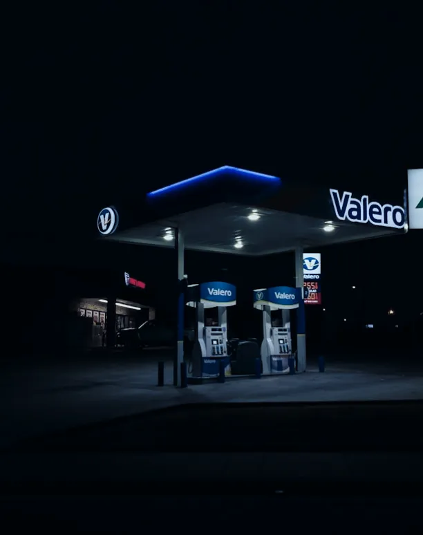 Valero gas station canopy glowing in dark.