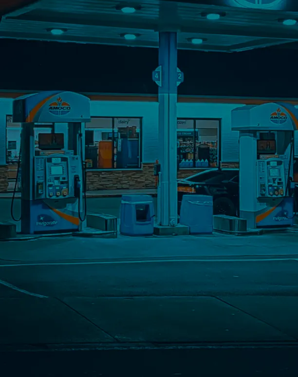 Gas pumps in front of convenience store.