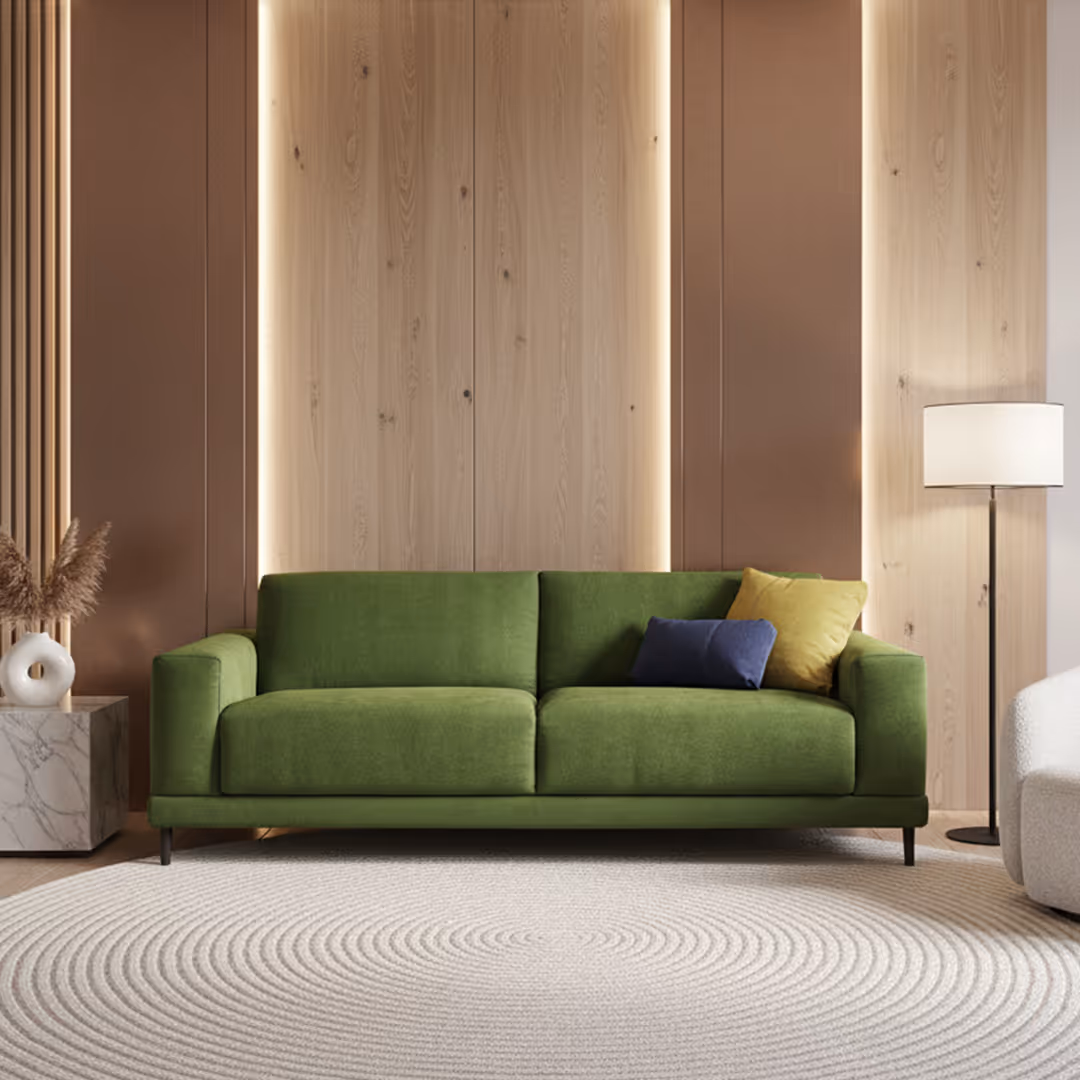 Contemporary Scadinavian hotel guest room with green sofa bed, wood accent wall, and marble side table with pampas grass