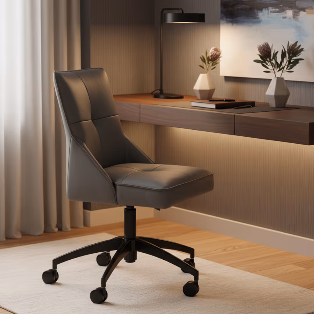 Contemporary hotel guestroom with refined 1902 Norte swivel desk chair, floating wood desk, protea flowers, and abstract artwork