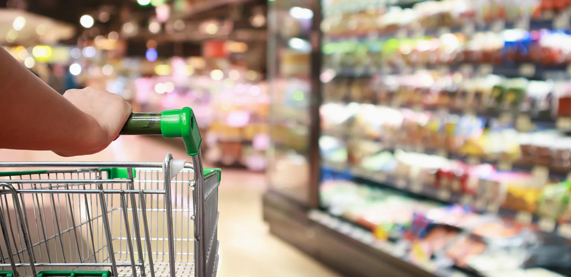A hand on a shopping cart