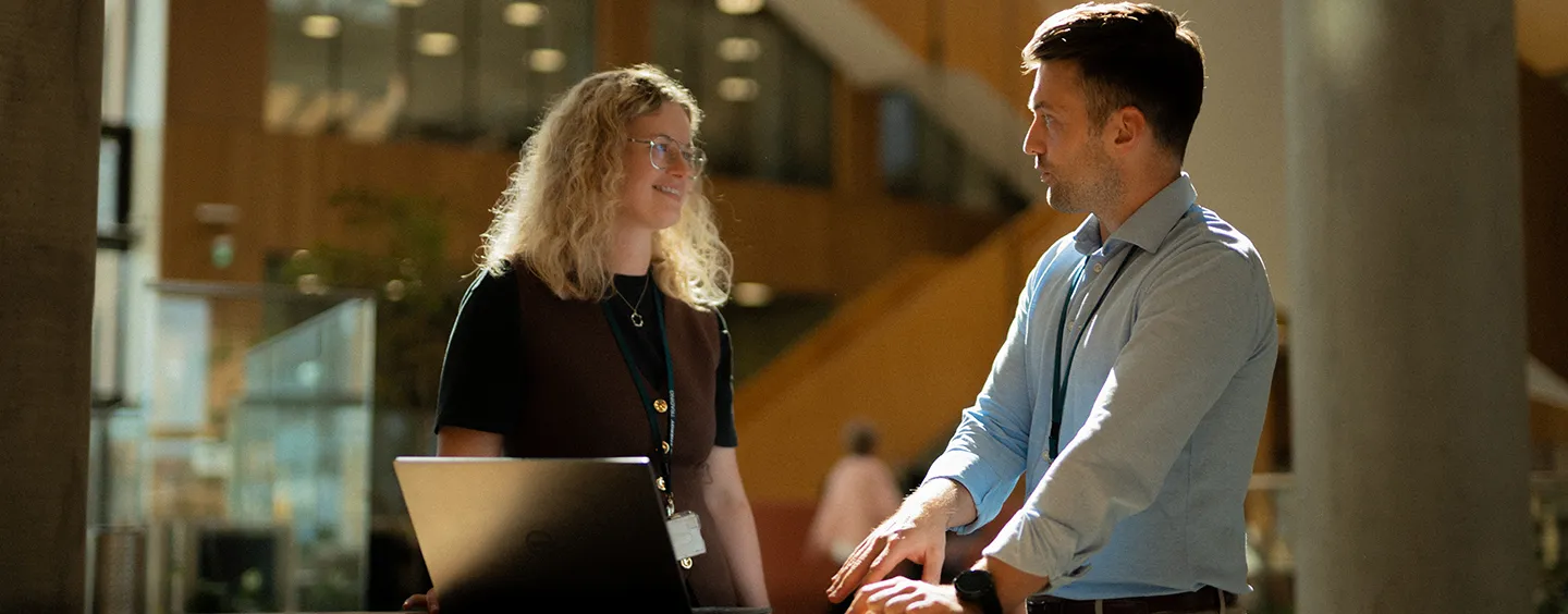 A woman and a man talking