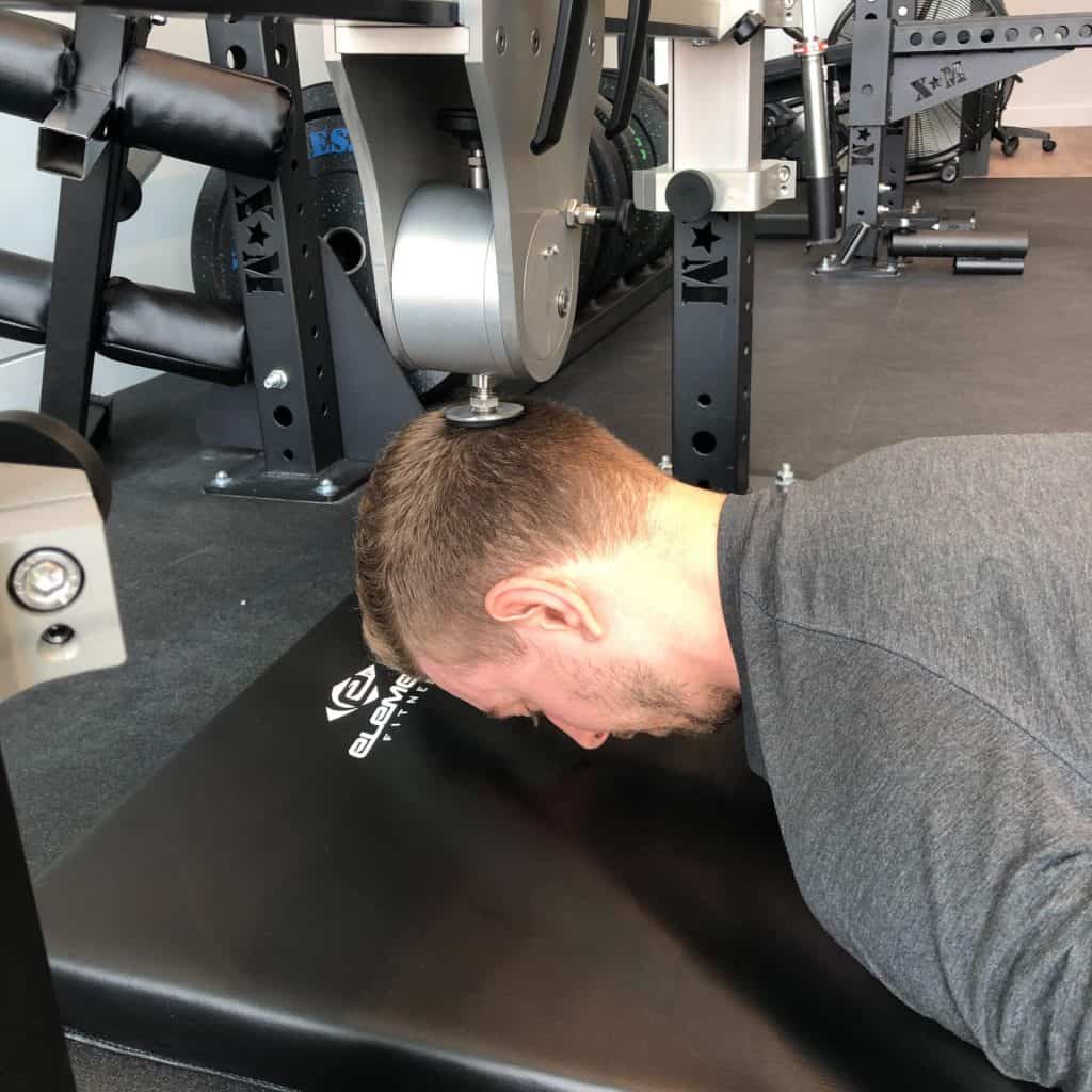 Prone-neck-extension-min-scaled-e1595362007549-1024x1024