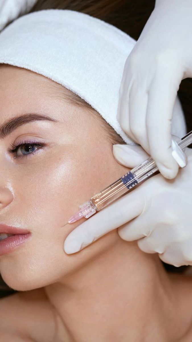 Aesthetic medicine procedure with injection in clinical skincare treatment