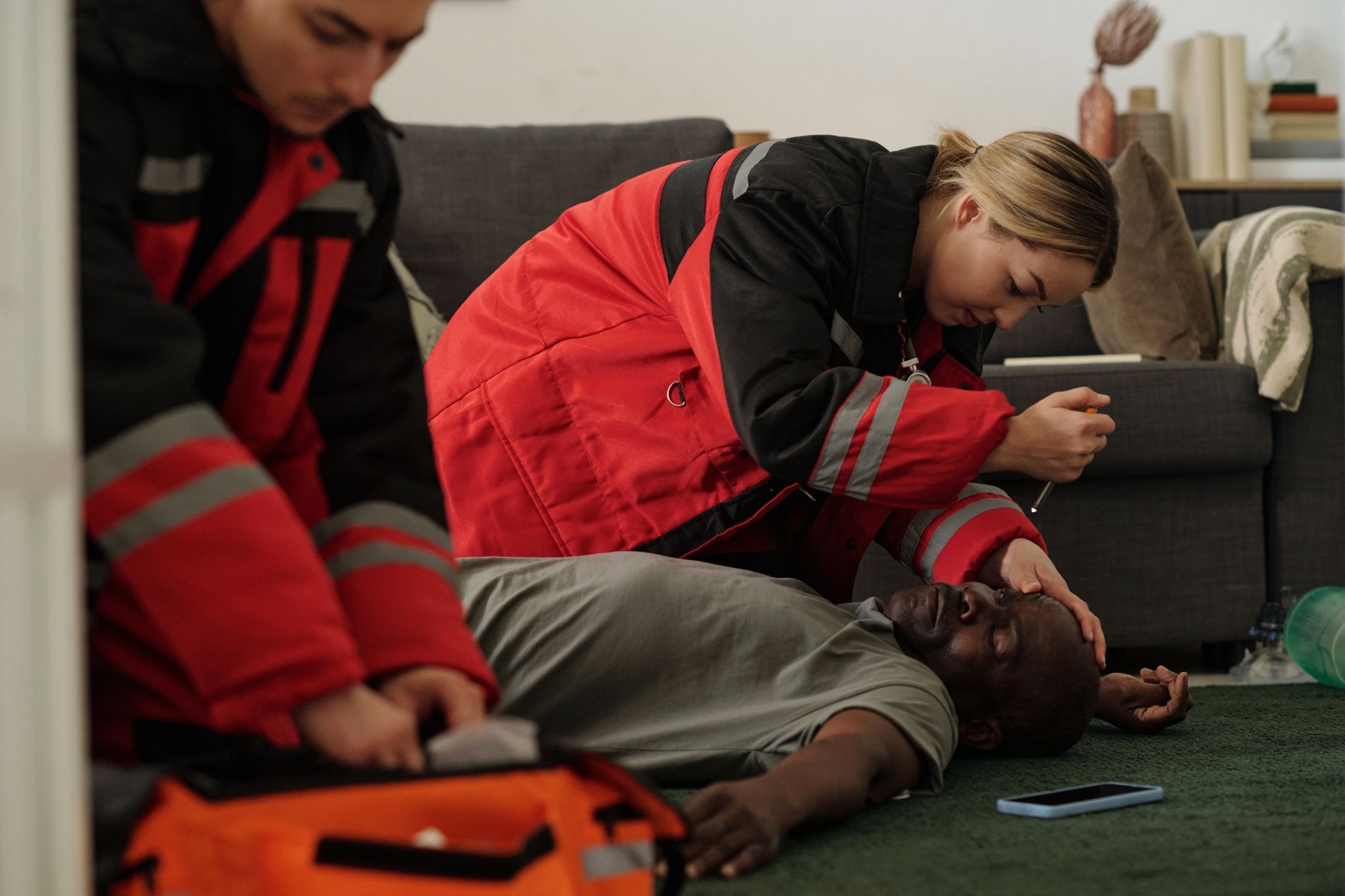Paramedics treating patient showing impact of secondary traumatic stress