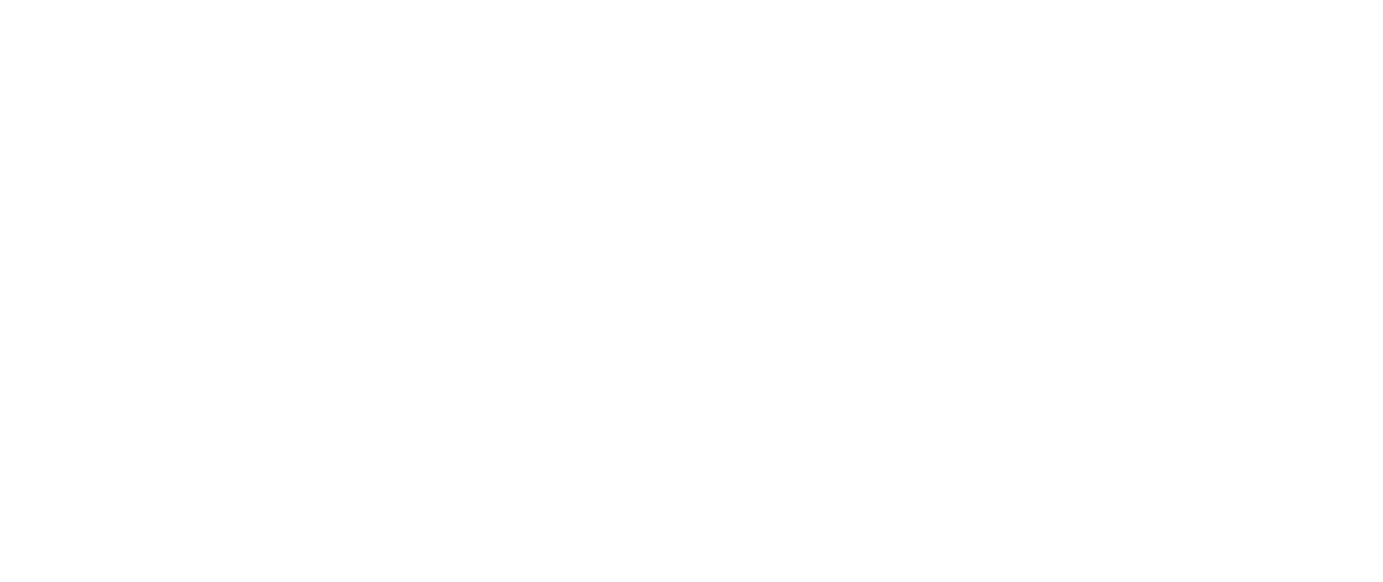 Smiling female doctor wearing a white coat and stethoscope standing with arms crossed against a dark background.