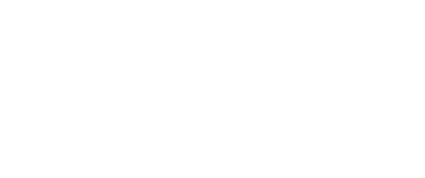 Smiling female doctor wearing a white coat and stethoscope standing with arms crossed against a dark background.