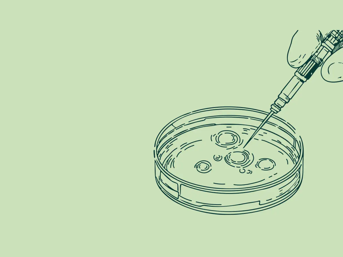 Illustration of a hand holding a syringe injecting into a petri dish with circular cell-like structures.