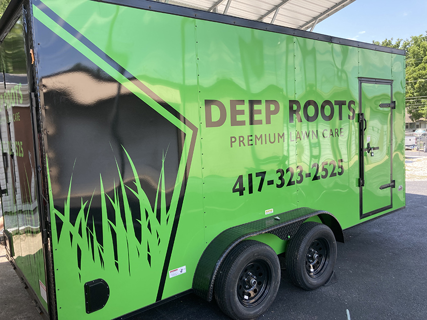 Di-cut graphic on lawn companies enclosed trailer