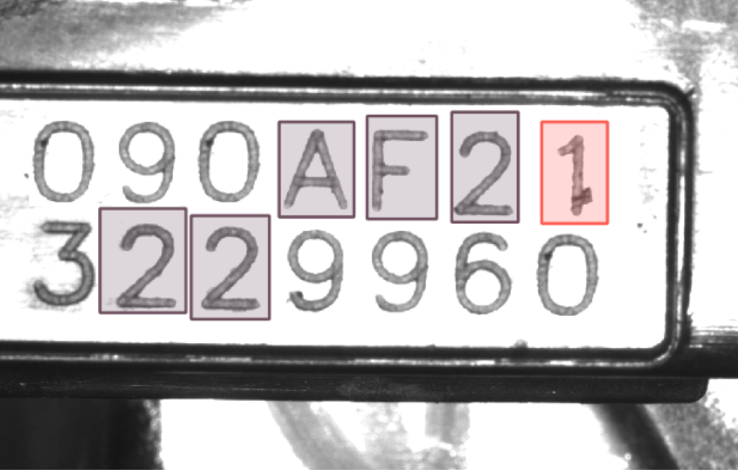 A metal plate with an imprinted sequence of alphanumeric characters